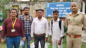 Rescued child with guardian and police officer