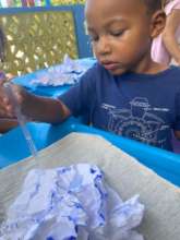 Child engages in Paper Mountains activity DKIII