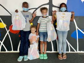 Kids receive discovery kits at the VICM