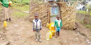 Queuing for water at the new water point