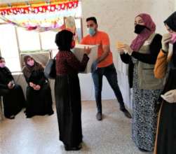 A mom in Mosul gets box of food, hygiene supplies