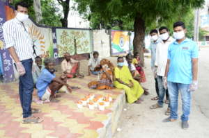 hungry homeless people getting food from best ngo