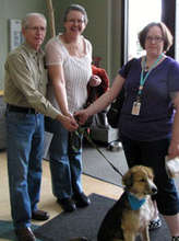 Bear with his new family and foster mom