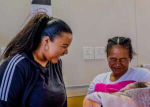 A happy recipient of a Baby Shower Bag