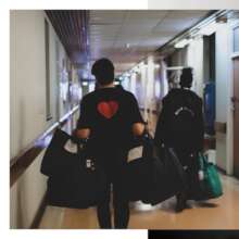 Carrying bags down the hospital corridor