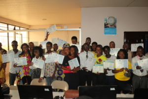Students with their Certificates of Completion