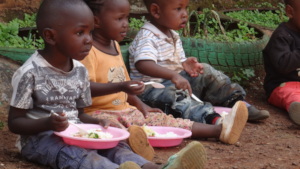 Little children enjoying their meals.