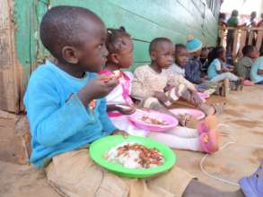 Children enjoying their hot meals.