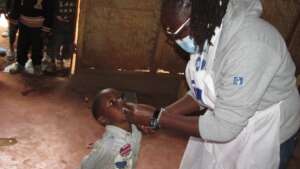 Vitamin A being administered to children.