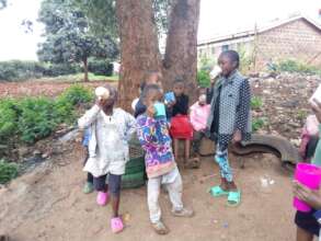 Children enjoying a cup of porridge.