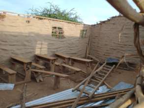 Storm damaged pieces in the unusable school-room