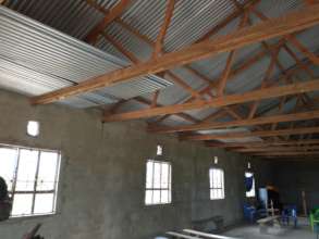 New school roofing sheets stored in the Church