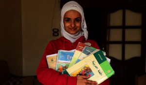 Fatima with her school textbooks