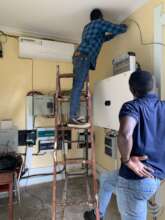 Completing the wiring in the dairy