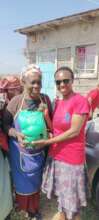 Daisy giving food hampers to the elderly