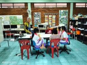 Geoff engages Warm Heart students to speak English