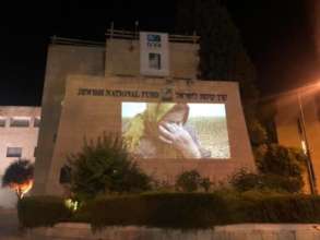 Amal Sumarin projected onto the JNF building