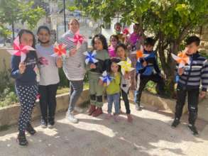 Madaa Creative Center children make pinwheels