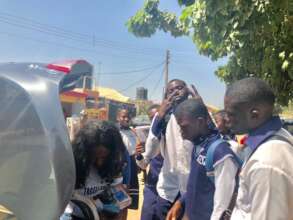 THE TEENAGERS ANXIOUS TO COLLECT BOOKS AND PEN