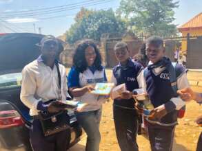 THE STUDENT ARE HAPPY HOLDING THEIR BOOKS AND PEN