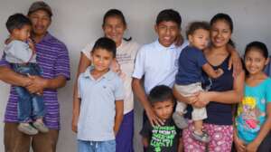 Our student surrounded by his grateful family