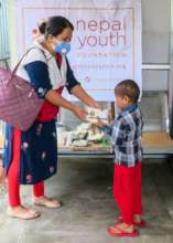 NYF staff distributes Lito packages!