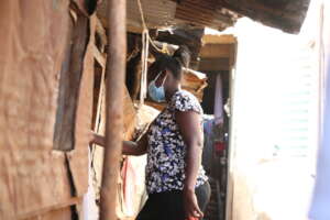 Quinter, a CHV,  working in Kibera