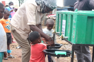 Community Members Using CFK WASH Station