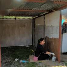 Volunteer Shaili painting one of the shelters