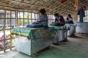Girls studying on tin trunks in Sundarbans
