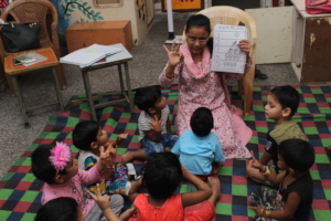 Aanganwadi children identifying numbers