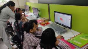 Computer class with primary students