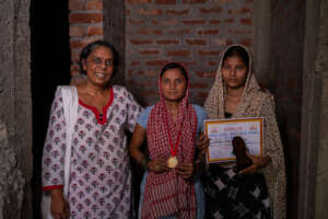 A girl with a medal and a certificate