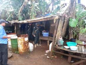 Rangers searching hut, where they noticed the bin