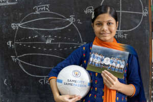 Minakshi with a special gift from ManCity