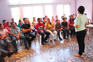 Programs Coordinator addressing aspiring scholars.