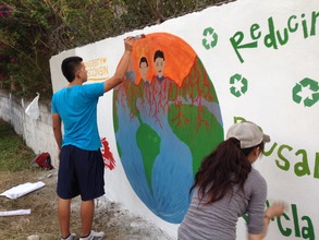 Paiting environmental mural at local school