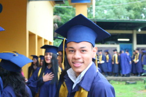 OYE scholar at high school graduation in December
