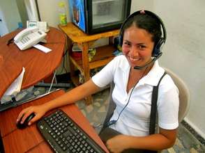 Rosa, OYE scholar, using a donated computer