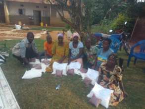 Beneficiaries receiving Covid food relief items