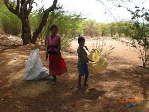 Children picking rags and waste paper on the stree