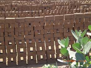 Children make bricks with parents