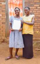 Justine with her mother display her written script