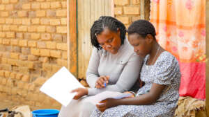 Justine writing holiday script with Cosma staff