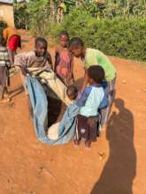 Children participate in drying coffee