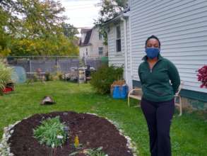Detroit homeowner, with new rain garden