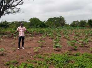 A Youth-farmer proudly showing off his farm