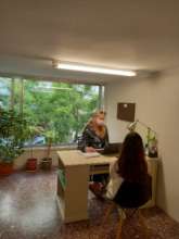 Our Head of Legal meeting with a beneficiary woman
