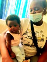 Single mother with her daughter receiving support