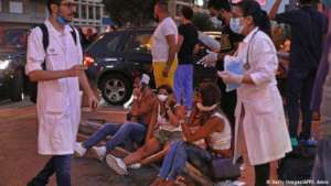 People Receiving First Aid in the Streets